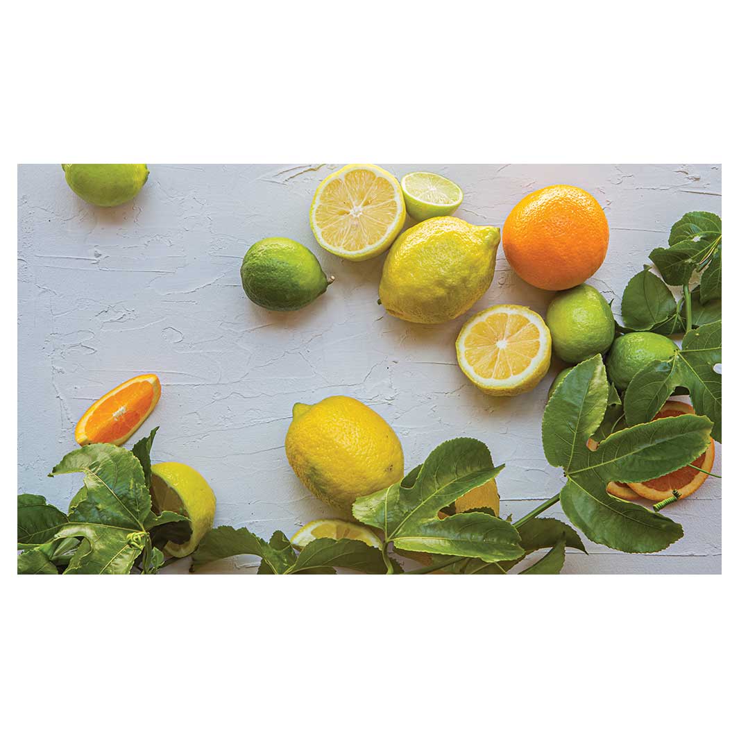 NATURAL YELLOW AND ORANGE CITRUS ON WHITE TABLECLOTH