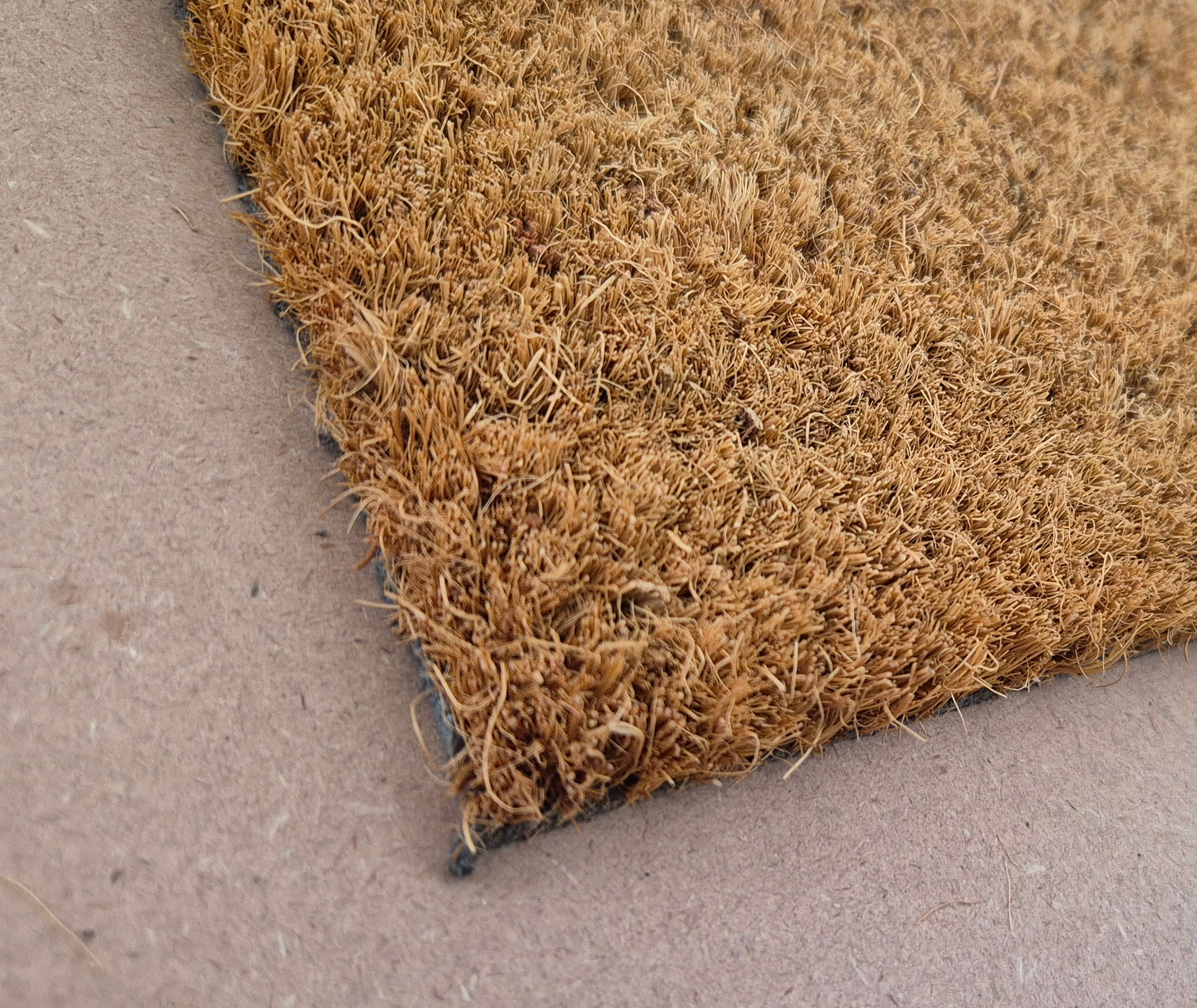 WELCOME CURSIVE- RUBBER EMBOSSED COIR VINYL-BACKED DOORMAT