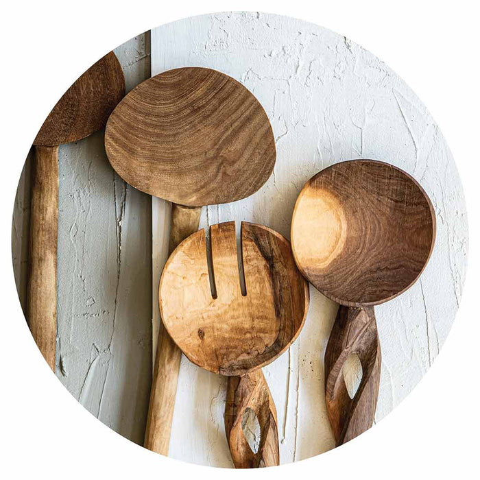 NATURAL BROWN WOODEN SPOONS ON GREY AND WHITE ROUND COFFEE TABLE