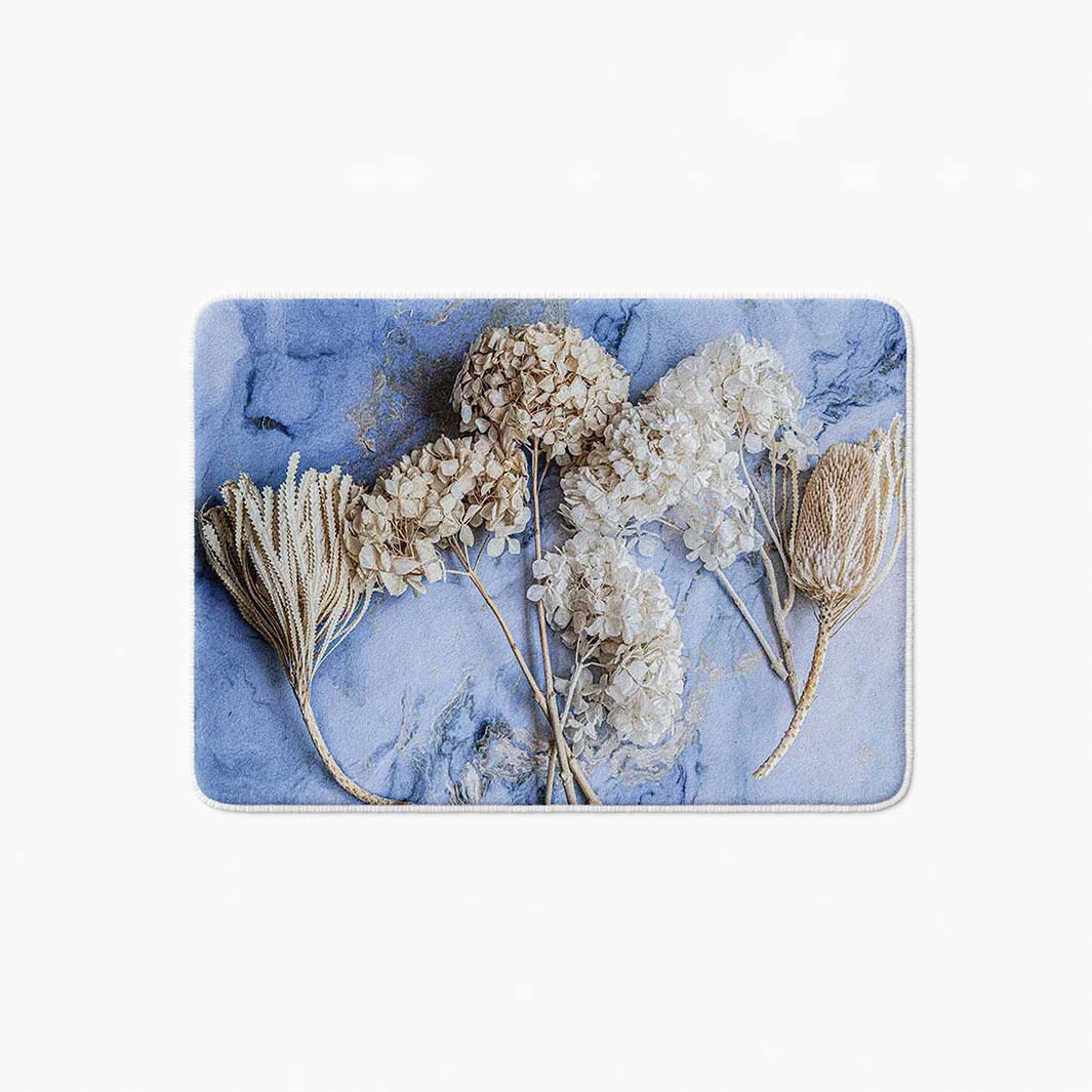 FLORAL CREAM BLEACHED HYDRANGEAS ON BLUE BATHMAT