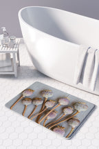 NATURAL PURPLE GIANT POPPY SEEDS ON GREY BATHMAT