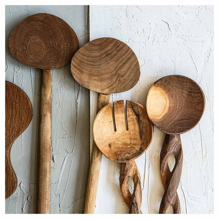 NATURAL BROWN WOODEN SPOONS ON GREY AND WHITE NAPKIN