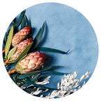 PROTEA, EUCALYPTUS AND WHITE FOLIAGE ON BLUE PLACEMAT