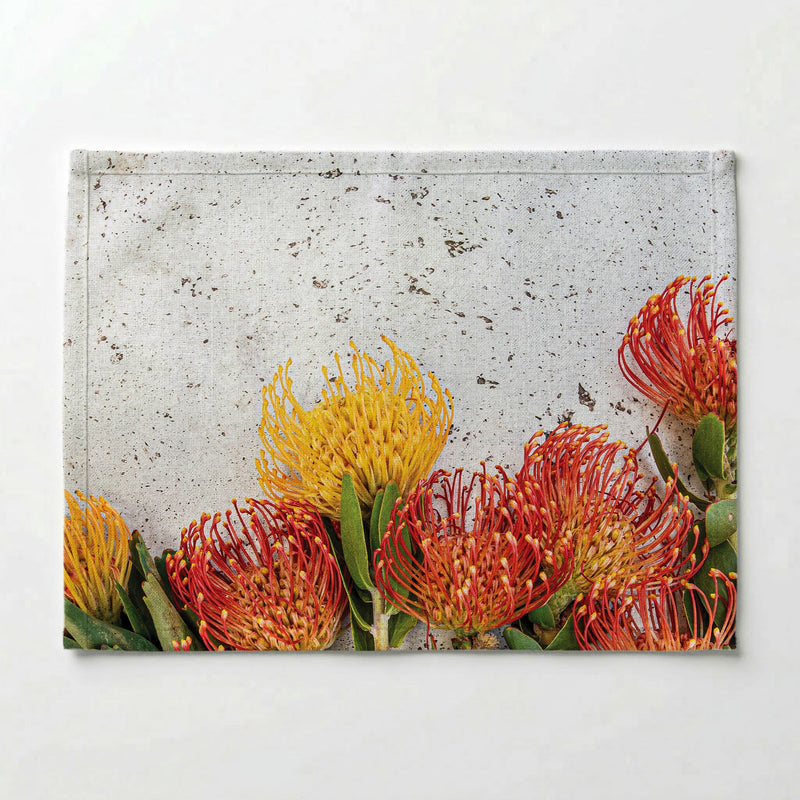FLORAL ORANGE PIN CUSHIONS ON WHITE PLACEMAT