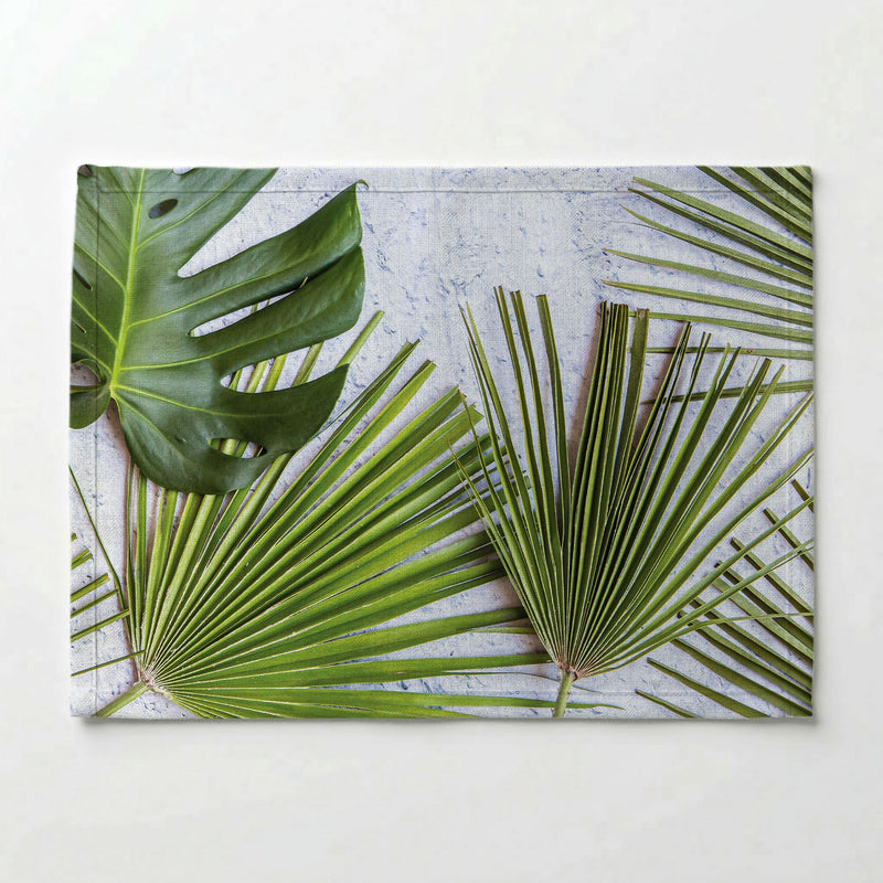LEAVES GREEN PALM LEAVES ON WHITE PLACEMAT