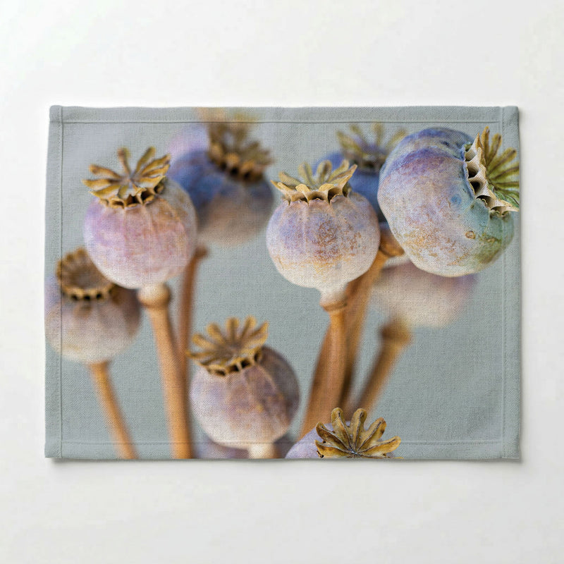 NATURAL PURPLE GIANT POPPY SEED BUNCH ON GREY PLACEMAT