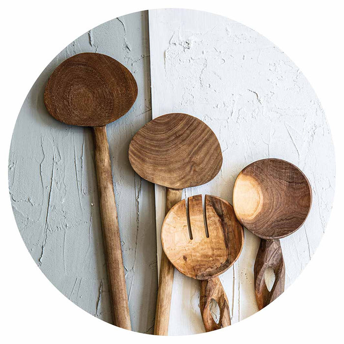 NATURAL BROWN WOODEN SPOONS ON GREY AND WHITE SERVING BOARD