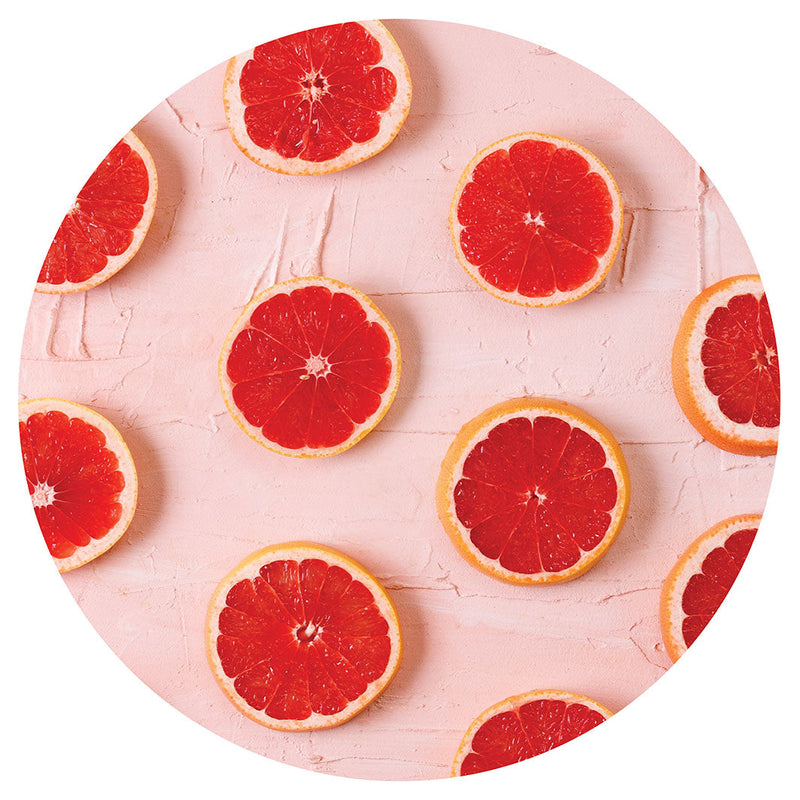 GRAPEFRUIT SLICES ON PINK CHEESEBOARD