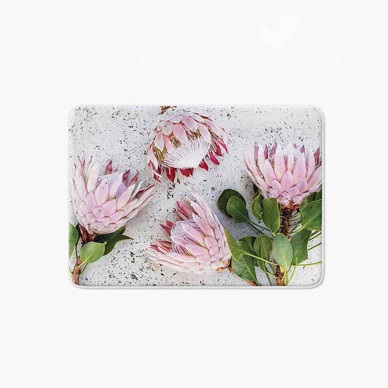 FLORAL PINK PROTEAS ON WHITE BATHMAT
