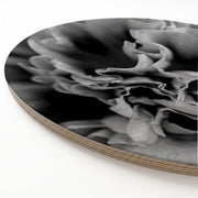 Round wooden serving board featuring a printed black-and-white photograph of a peony flower, shown at an angle on a white background.