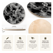 A product information graphic for a printed wooden serving board featuring a black and white floral peony print on one side and a natural light wood grain side. The graphic includes a circular close-up of the wood texture, a side profile with dimensions (30cm or 48cm diameter, 2cm height), and four feature callout boxes describing solid wood construction, durability, easy cleaning, and suitability for entertaining.