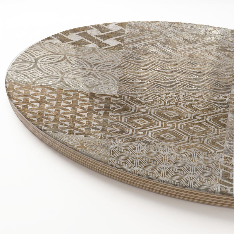 A close-up of a wooden serving board featuring a brown modern tile pattern print, with a visible layered wood edge on a white background.