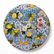 A round wooden serving board featuring a blue Lisbon tile with a lemons-and-flowers print on a white background.