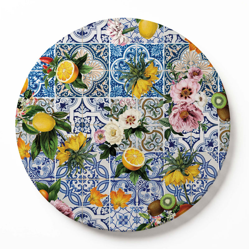 A round wooden serving board featuring a blue Lisbon tile with a lemons-and-flowers print on a white background.