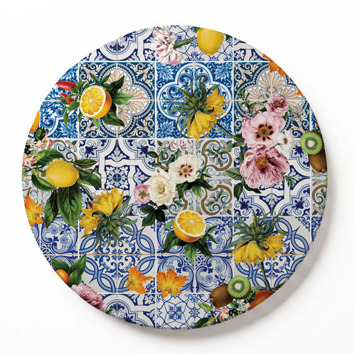 A round wooden serving board featuring a blue Lisbon tile with a lemons-and-flowers print on a white background.
