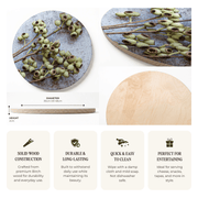 A product infographic for a round wooden serving board with a printed birch wood design of green amber nuts on a weathered grey-blue background. The infographic shows two views of the board, a height and diameter measurement, and four feature callouts for solid wood construction, durability, easy cleaning, and suitability for entertaining.