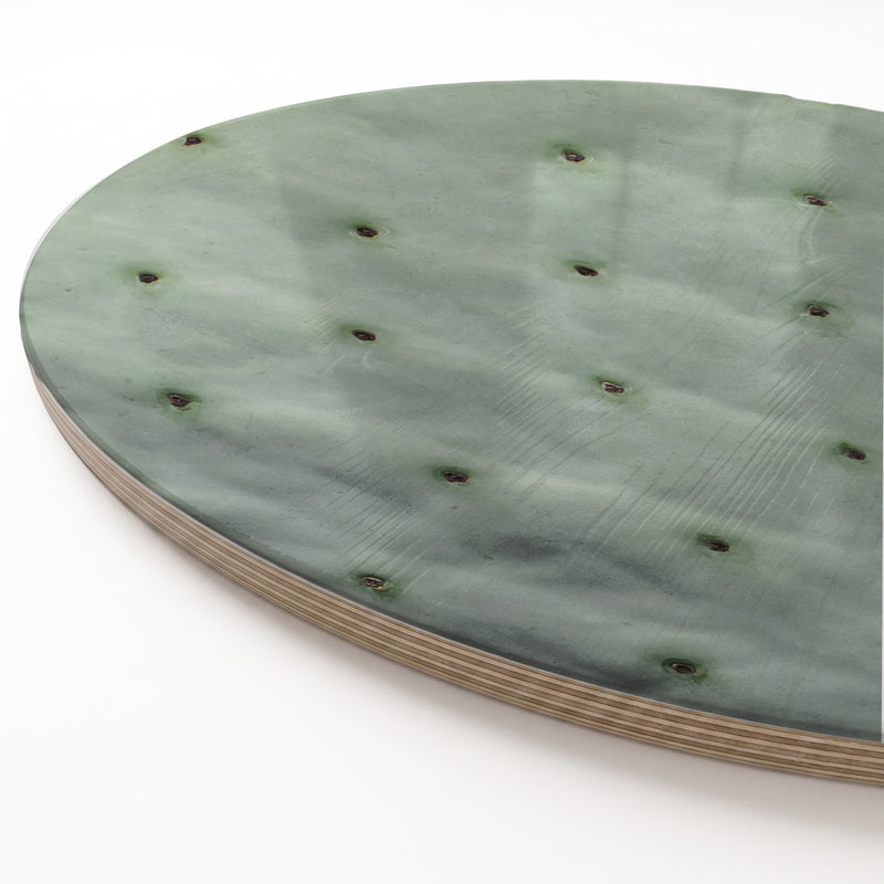A round wooden serving board featuring a green prickly pear leaf print, shown on a white background.
