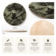 A product information graphic for a round wooden serving board with a dark green leaf print and a light natural wood side. The graphic includes two circular close-ups of the board's top and side, a height-and-diameter measurement callout, and four feature callouts at the bottom describing solid-wood construction, durability, easy cleaning, and suitability for entertaining.