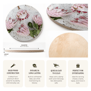 Round wooden serving platter with a printed pink protea flower pattern, shown from multiple angles with dimensions and feature callouts on a white background.