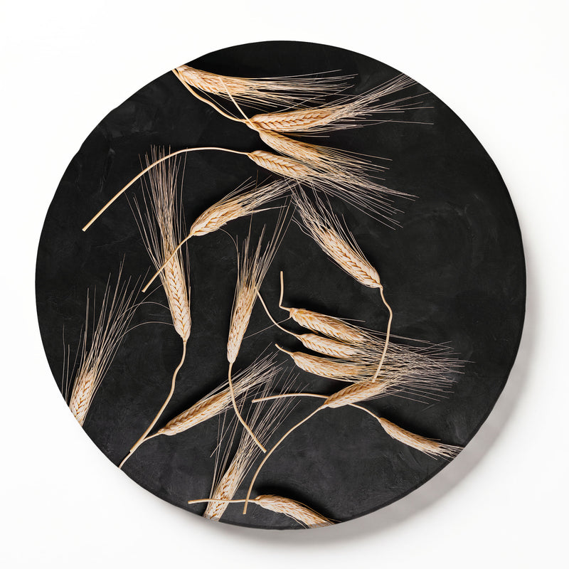 SCATTERED WHEAT ON BLACK ROUND SERVING BOARD