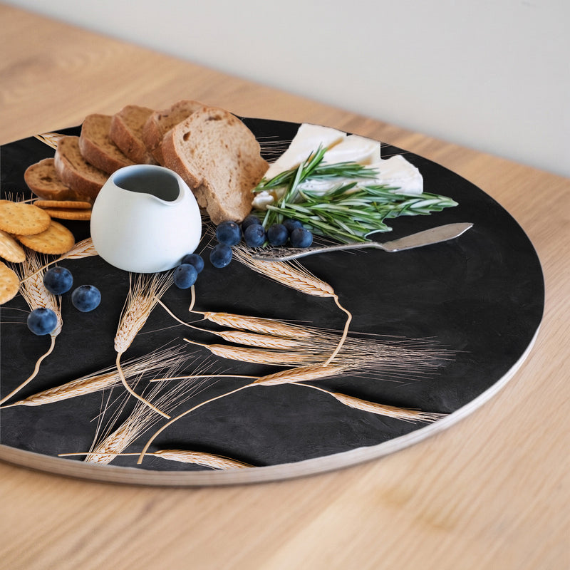 SCATTERED WHEAT ON BLACK ROUND SERVING BOARD