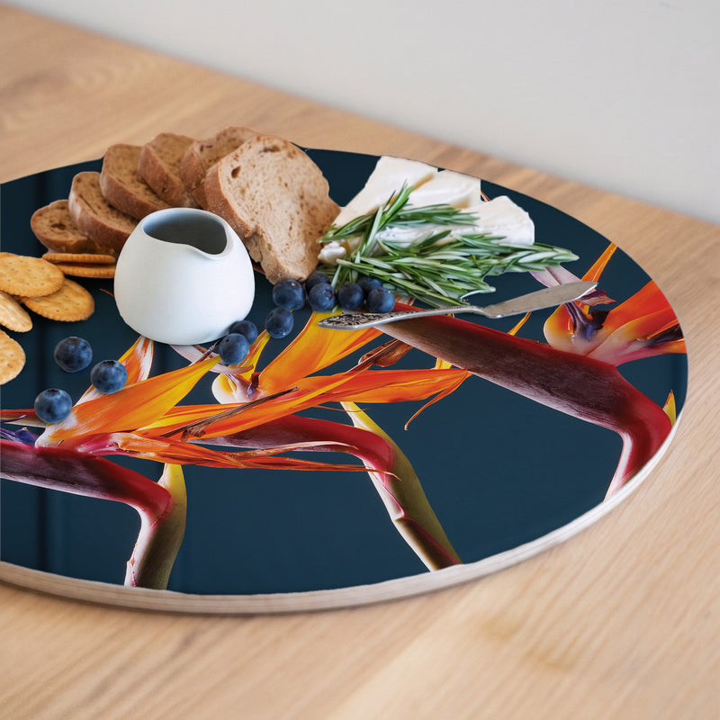 STRELITZIA TRIO ON RICH BLUE ROUND SERVING BOARD