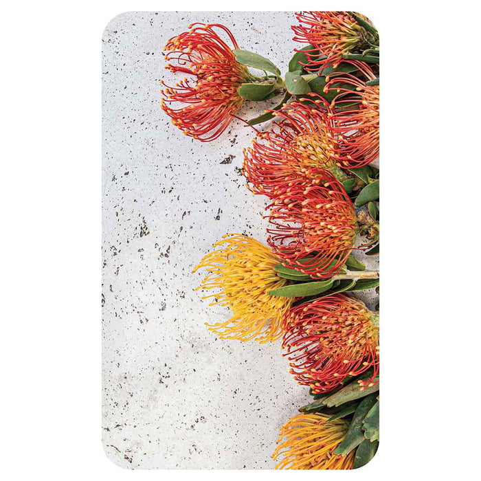 FLORAL ORANGE PIN CUSHIONS ON WHITE KITCHEN TOWEL