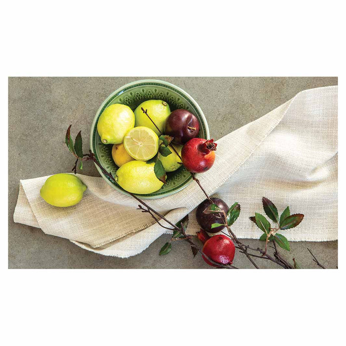NATURAL RED POMEGRANATES AND LEMONS WITH LINEN TABLECLOTH