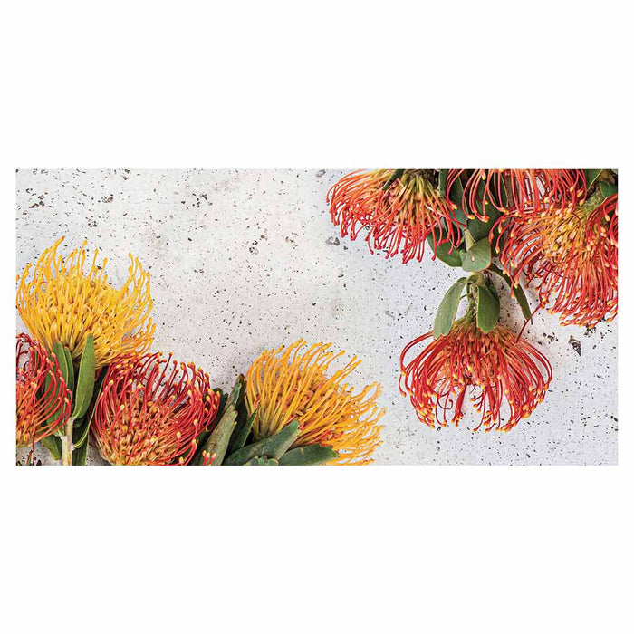 FLORAL ORANGE PIN CUSHIONS ON WHITE TABLECLOTH