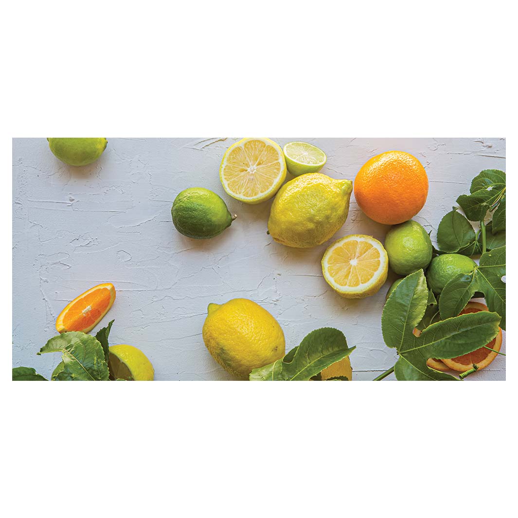 NATURAL YELLOW AND ORANGE CITRUS ON WHITE TABLECLOTH