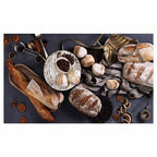 BREADS AND DRIED FRUIT ON BLACK TABLECLOTH