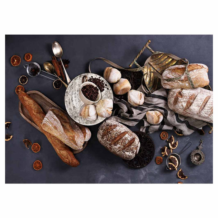BREADS AND DRIED FRUIT ON BLACK TABLECLOTH