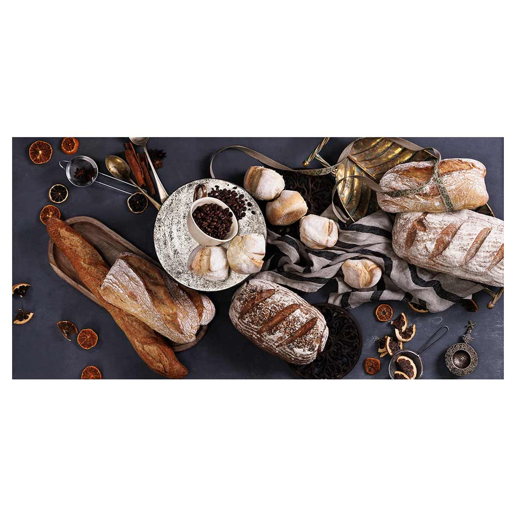 BREADS AND DRIED FRUIT ON BLACK TABLECLOTH
